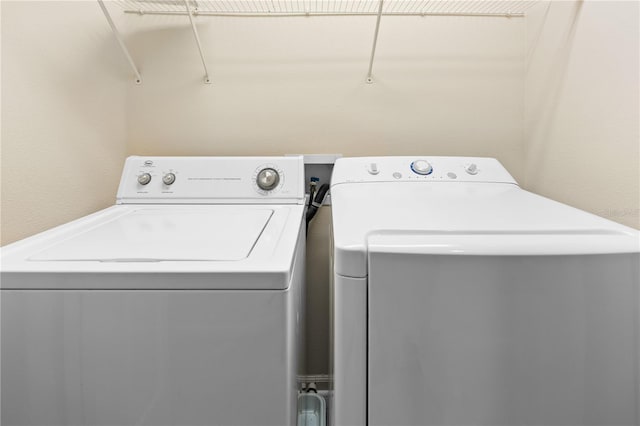 washroom with washer hookup and washing machine and clothes dryer