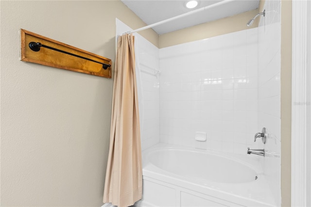 bathroom with shower / bathtub combination with curtain