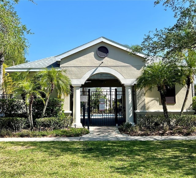 entrance to property with a yard