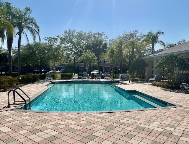 view of swimming pool with a patio