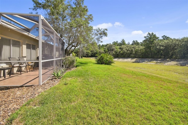 view of yard featuring a lanai and a patio