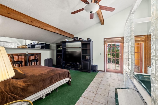 bedroom featuring tile patterned flooring, vaulted ceiling with beams, and ceiling fan