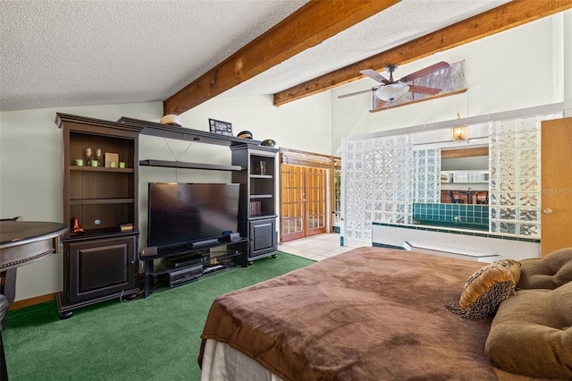 carpeted bedroom with a textured ceiling, vaulted ceiling with beams, and ceiling fan