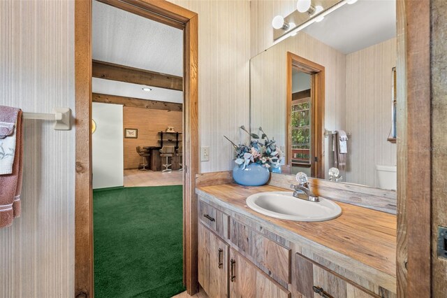 bathroom featuring vanity and toilet