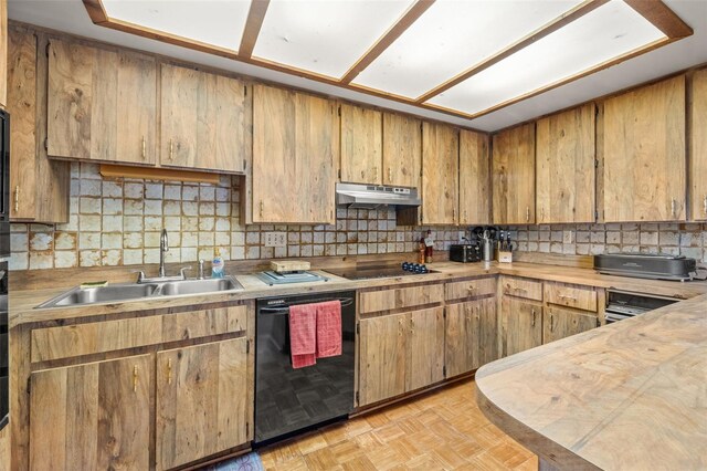 kitchen with black appliances, sink, and light parquet flooring