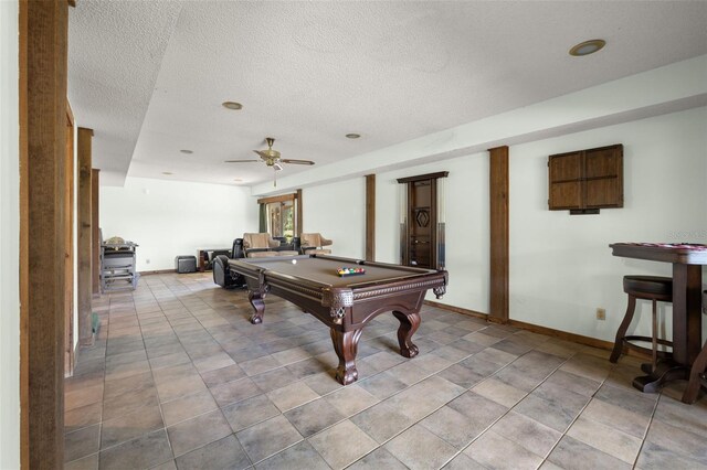 rec room with ceiling fan, a textured ceiling, and pool table