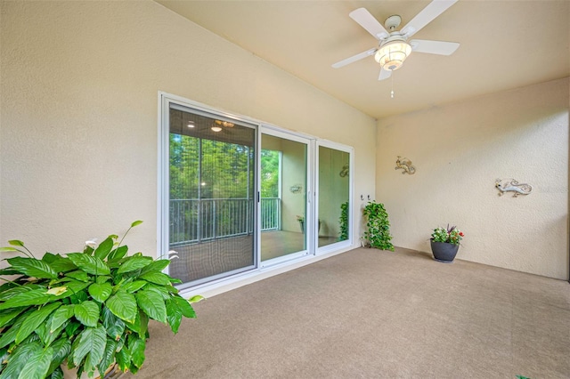 view of patio featuring ceiling fan