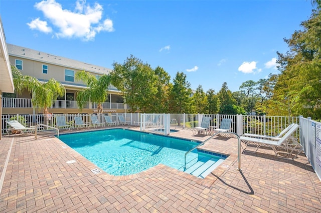 view of swimming pool featuring a patio area