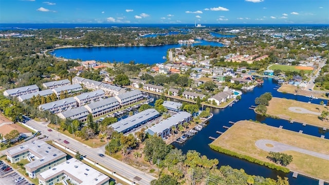 birds eye view of property with a water view