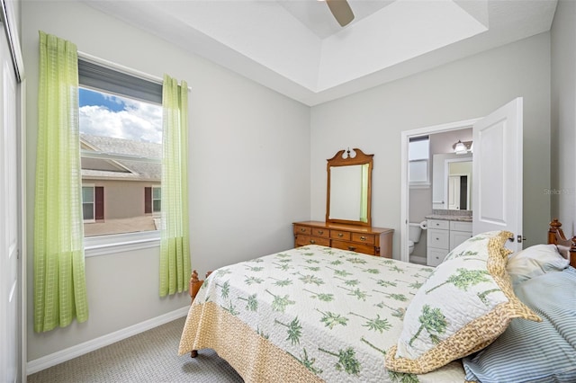 bedroom featuring carpet flooring, ceiling fan, and connected bathroom