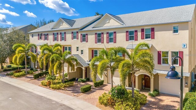 townhome / multi-family property featuring a garage