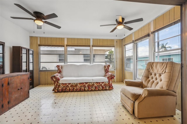 sunroom featuring ceiling fan