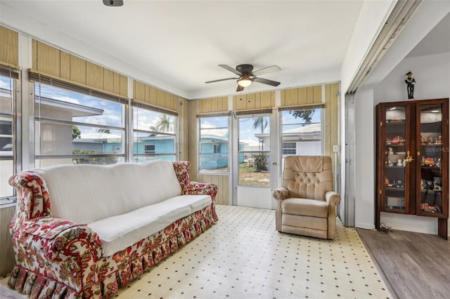 sunroom with ceiling fan and a healthy amount of sunlight