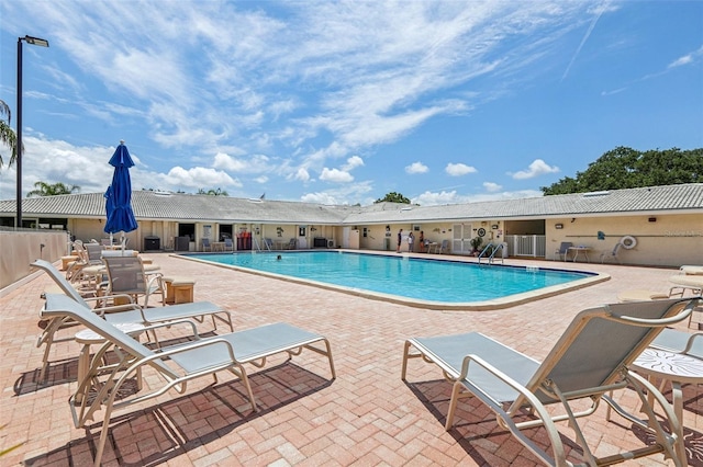 view of pool featuring a patio