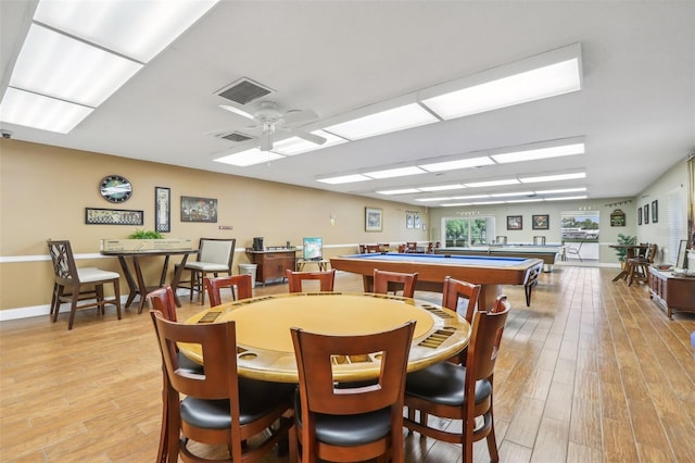 dining space featuring pool table, ceiling fan, and light hardwood / wood-style flooring