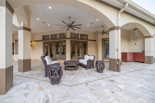 view of patio featuring ceiling fan and french doors