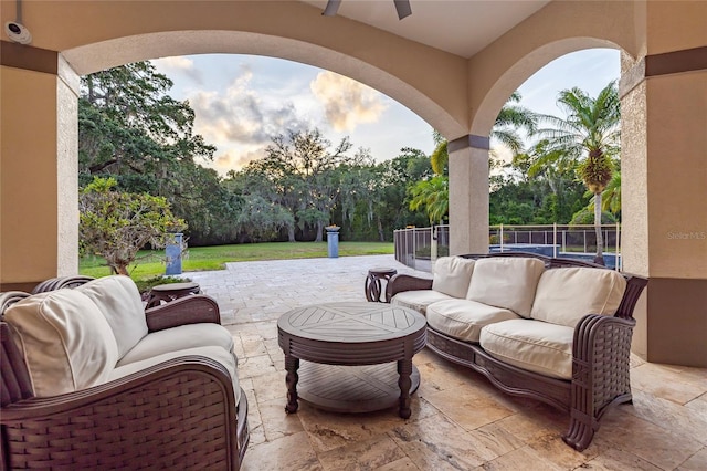 view of patio with ceiling fan and an outdoor hangout area