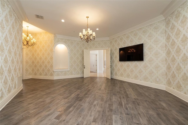 unfurnished living room with a chandelier, wood finished floors, and wallpapered walls