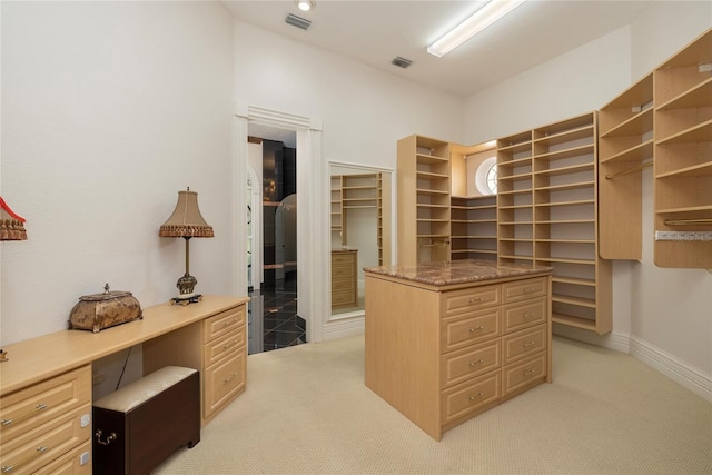 spacious closet with light carpet and visible vents