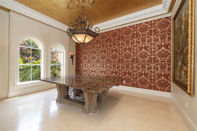 unfurnished dining area featuring wallpapered walls, baseboards, and a tray ceiling