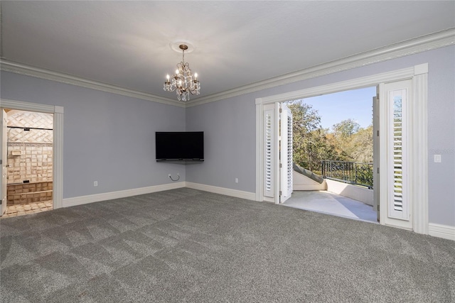 unfurnished living room featuring baseboards, ornamental molding, a chandelier, and carpet flooring