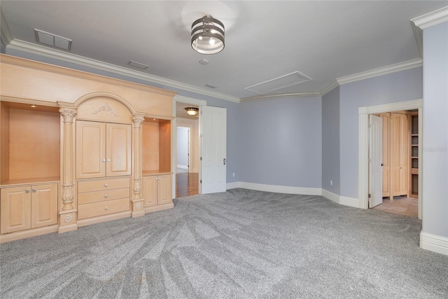 unfurnished bedroom with carpet, visible vents, and crown molding