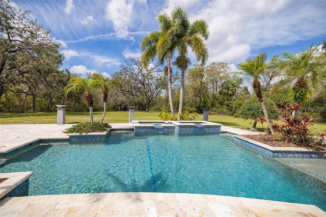 view of swimming pool with a lawn and a pool with connected hot tub