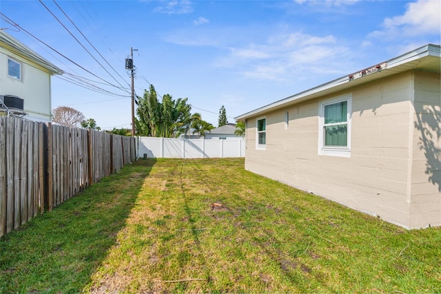 view of yard with central AC