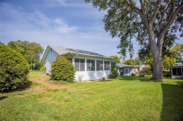 view of yard with a sunroom