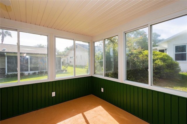 unfurnished sunroom with plenty of natural light