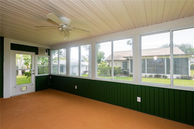 unfurnished sunroom with wood ceiling and ceiling fan