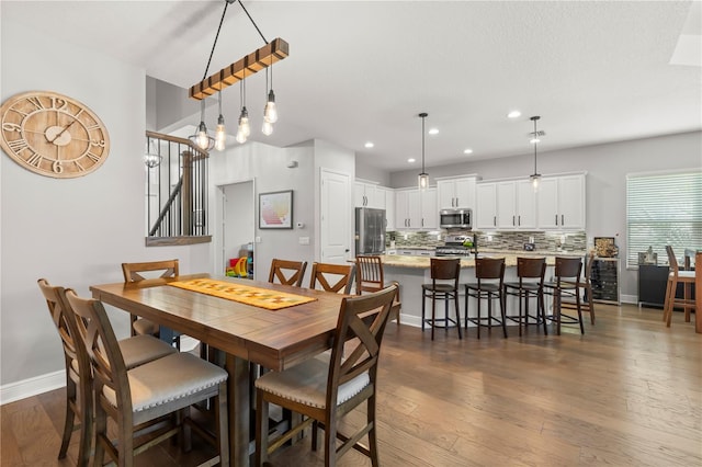 dining room featuring dark wood-type flooring