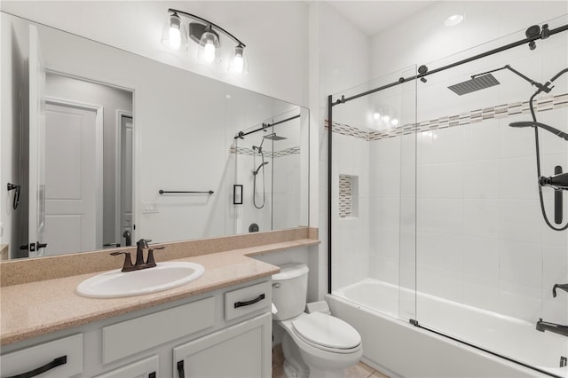 full bathroom with shower / bath combination with glass door, toilet, and vanity