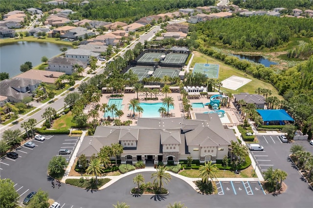 birds eye view of property with a water view