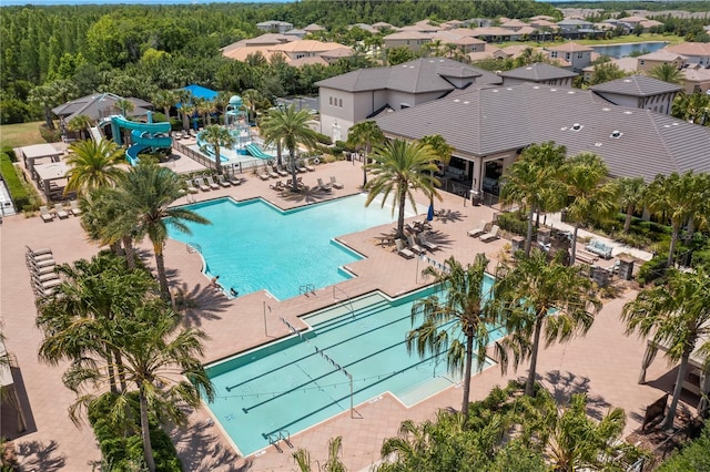 view of swimming pool featuring a patio area and a water slide