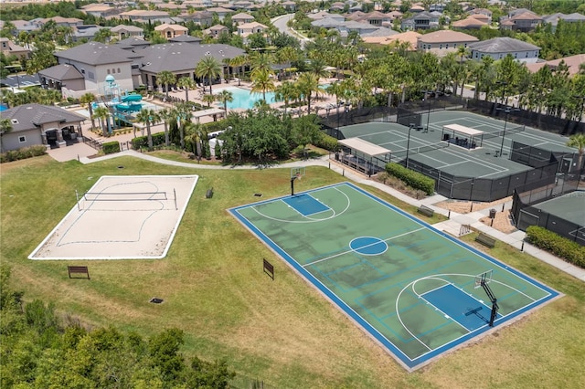 view of sport court featuring a yard