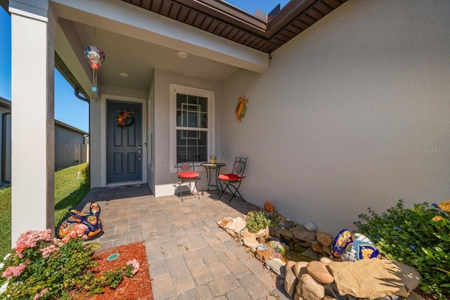 entrance to property with a patio