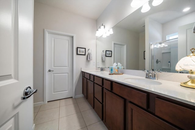 bathroom with vanity, tile patterned floors, and walk in shower