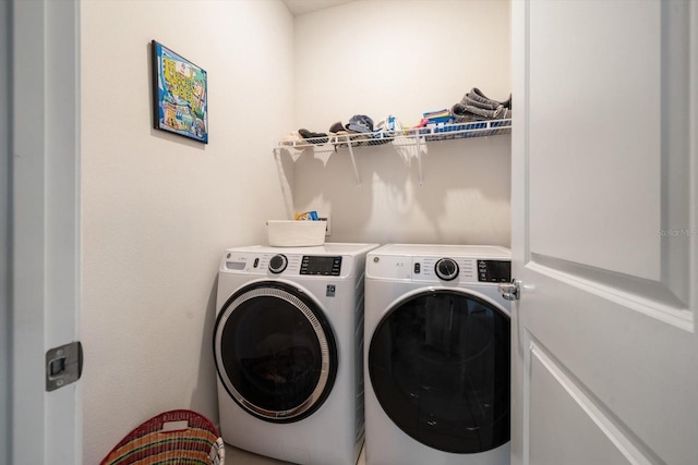 clothes washing area with washer and dryer