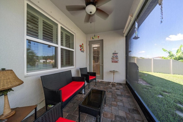 sunroom / solarium with ceiling fan and plenty of natural light