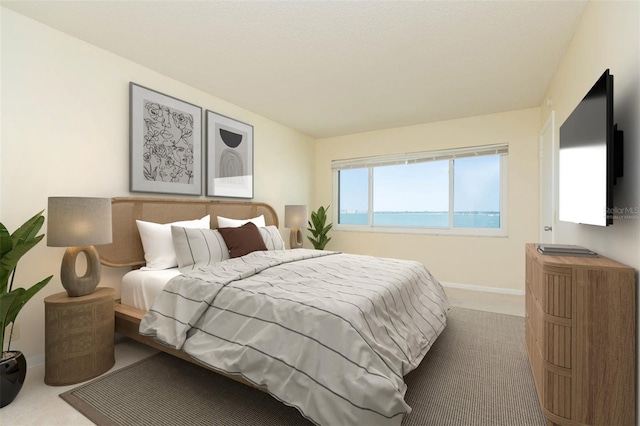 carpeted bedroom with a water view