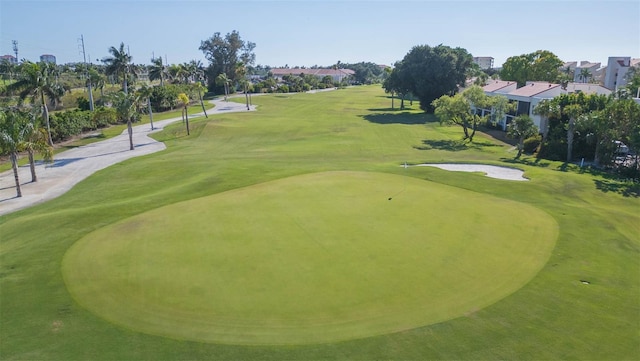 view of home's community featuring a lawn