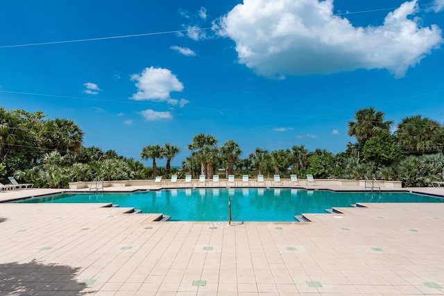 community pool with a patio area