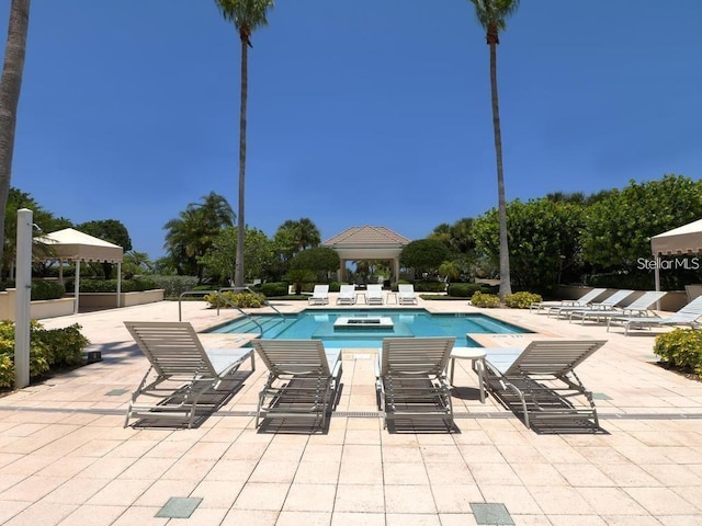 pool featuring a gazebo and a patio