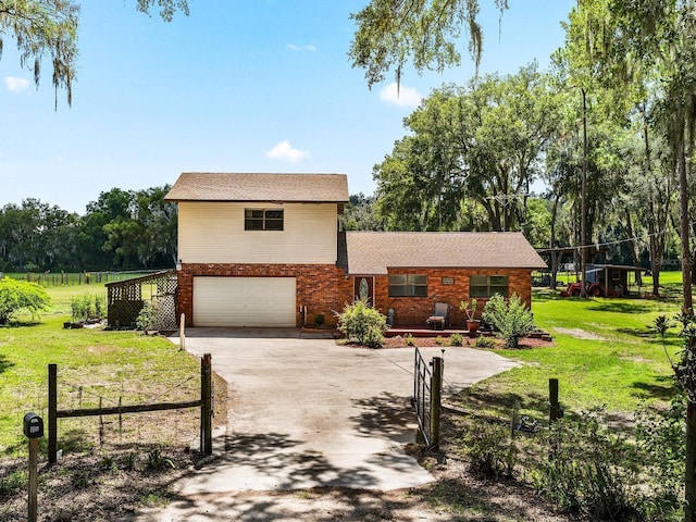 view of front of house with a garage and a front lawn