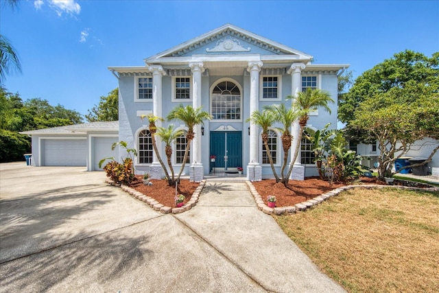 greek revival house with a garage