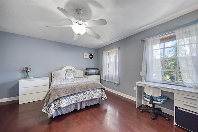 bedroom with ceiling fan and dark hardwood / wood-style flooring