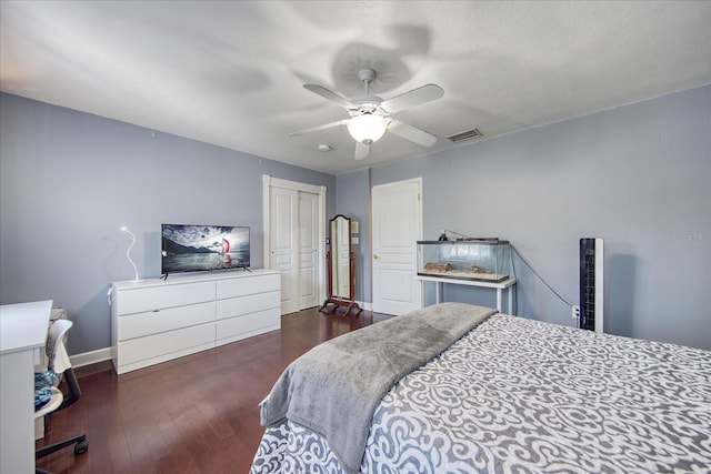 bedroom featuring dark hardwood / wood-style floors and ceiling fan