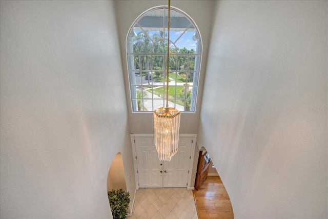 entryway with a towering ceiling