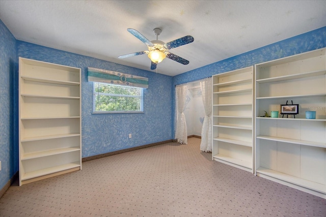 unfurnished bedroom with carpet flooring and ceiling fan